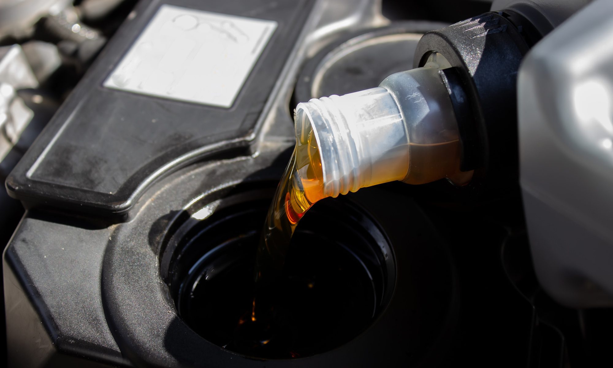 Refueling and pouring oil quality into the engine motor car Transmission and Maintenance Gear .