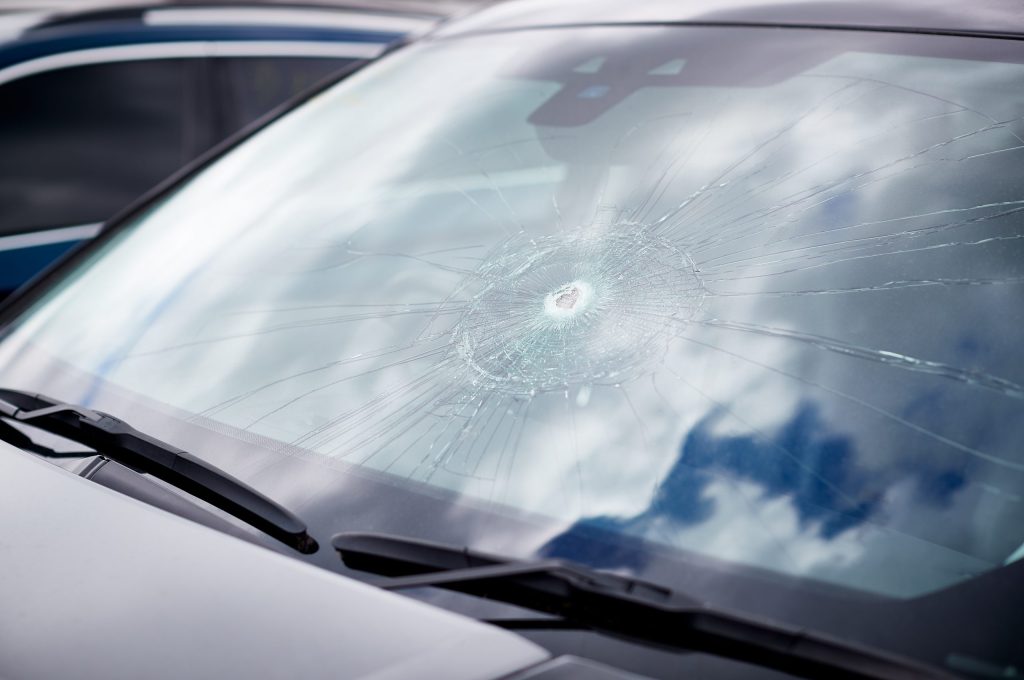Detail Of Damage To Windscreen Of Car Shattered By Vandalism